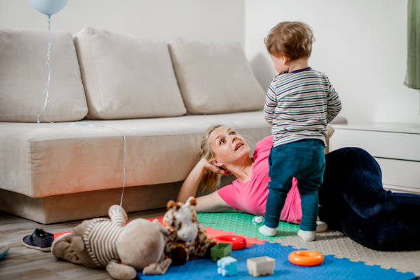 istock Mother and son having fun at home 1141978654