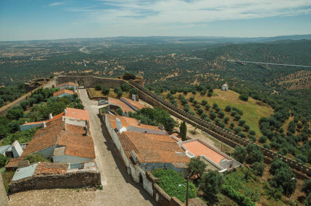 istock Main street and landscape with green hills at Evoramonte 1141978711