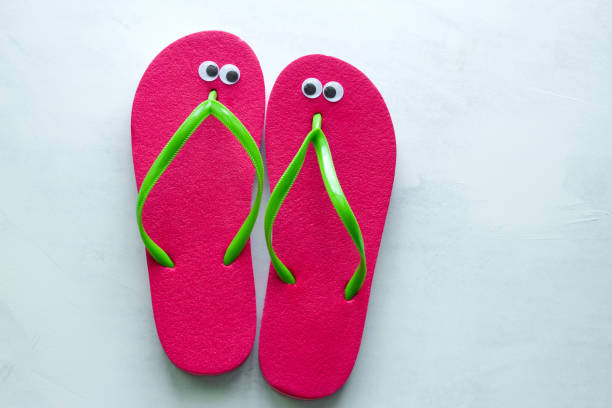 istock summer flat lay flip flops with googly eyes 1141982784