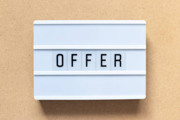 istock White lightbox with word offer on wood background 1141983800