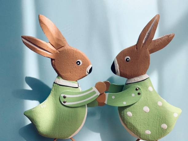 istock Two toy rabbits on blue background 1141985864