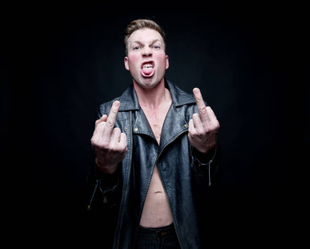 istock Sexy man wearing a leather jacket and no shirt 1141990909