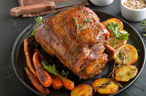 istock Baked pork, fried potatoes and carrots 1141991285