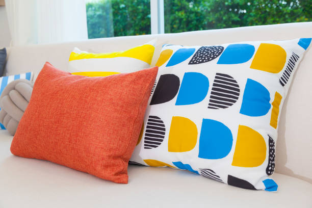 istock Colorful pillows on a sofa in modern living room. 1141991621