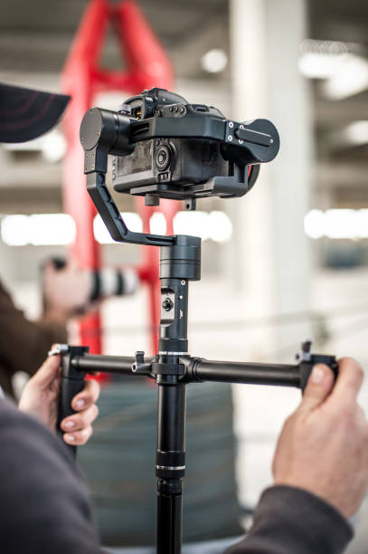 istock Man hand holding camera and take the photo 1141991851