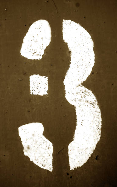 istock Number 3 in stencil on metal wall in brown tone 1141991957