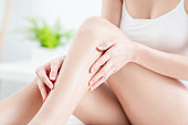 woman touching perfect shaved legs