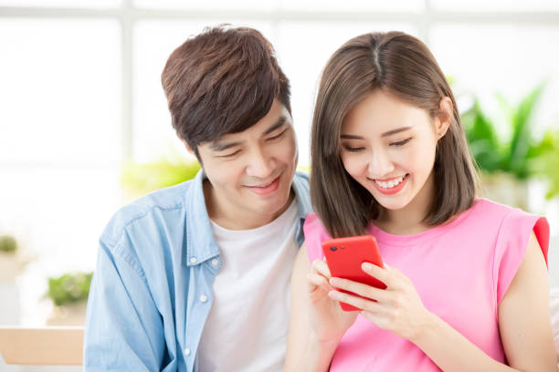 istock Pregnant couple use smart phone 1141993130