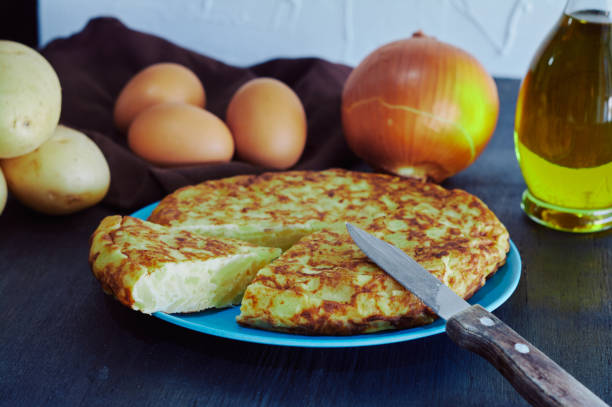 istock Spanish omelette with potato, egg and onion, accompanied by olive oil 1141994139