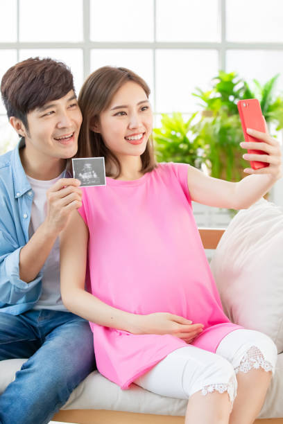 istock pregnant woman selfie with husband 1141994170