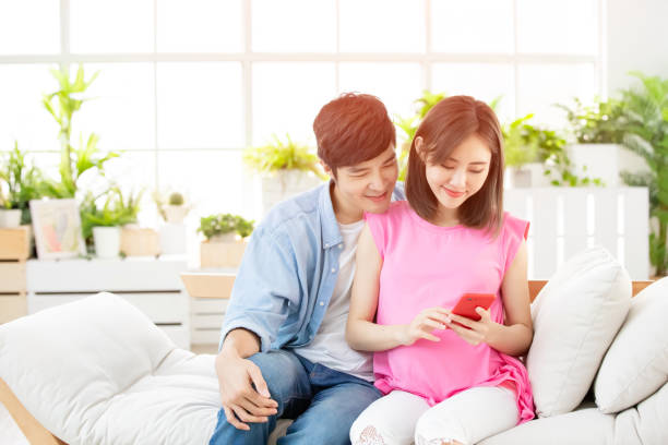 istock Pregnant couple use smart phone 1141994294