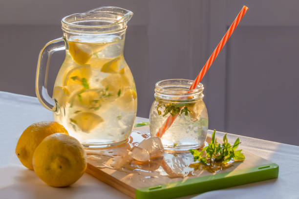 istock homemade lemonade with lemons, mint and ice on the table 1141994451