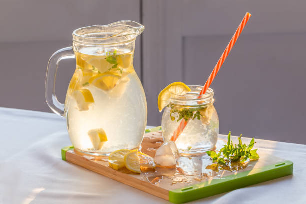 istock Fresh homemade lemonade on the table with lemons, mint and ice 1141994453
