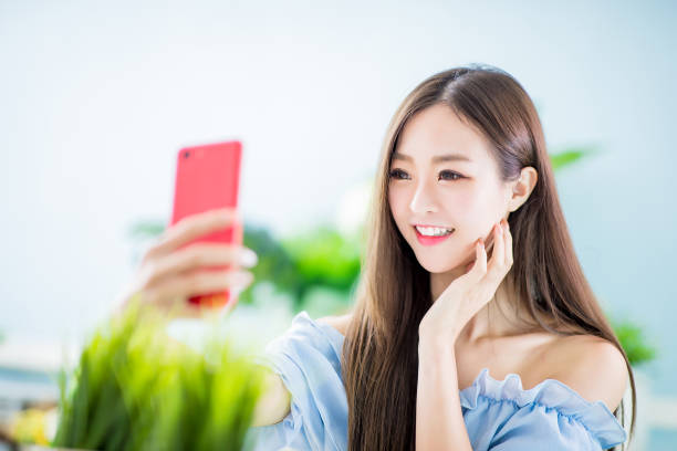 istock woman selfie happy 1141995738