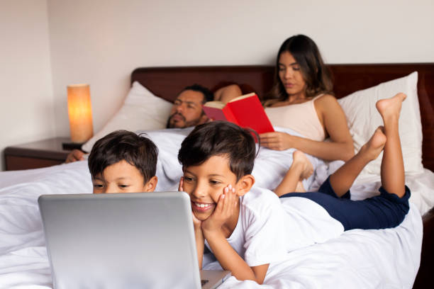 istock family sharing in bed 1141996002