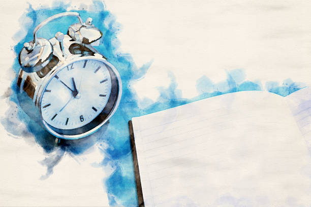 istock alarm clock on blue table with notepad in watercolors 1141996223
