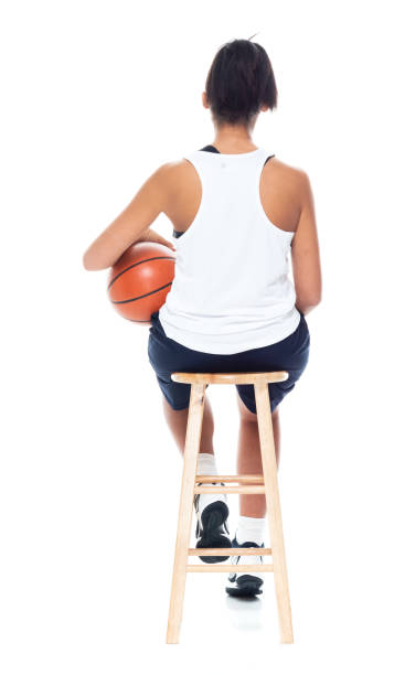istock African American basketball player on white background - sitting 1141996573
