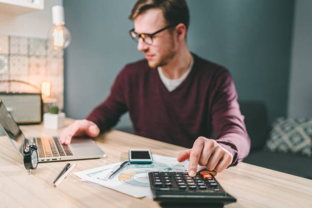 istock Male accountant working home 1141997661