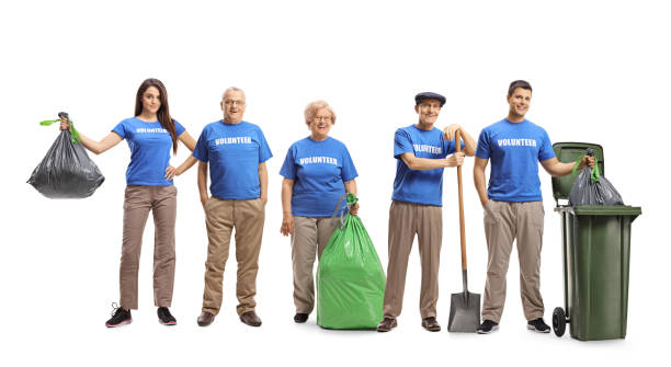 istock Group of volunteers cleaning waste 1141997783