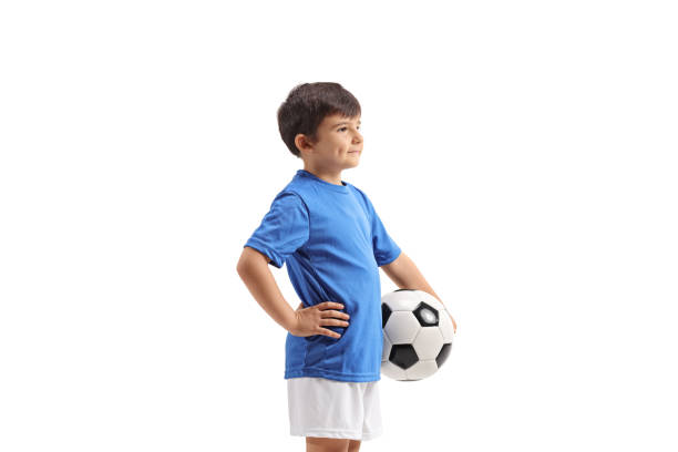 istock Little boy with a football standing 1141998358