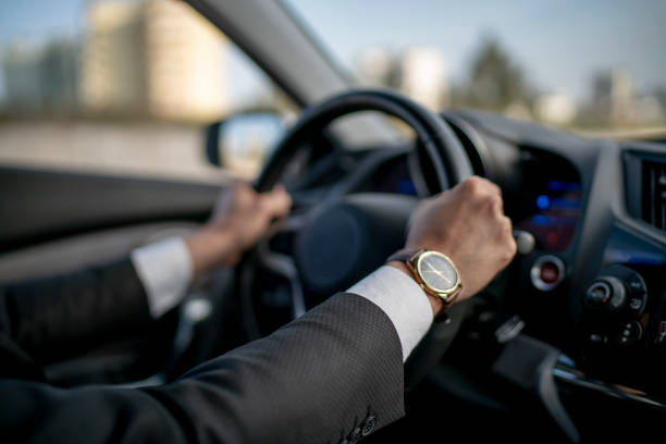 istock Businessman driving a car 1142000680
