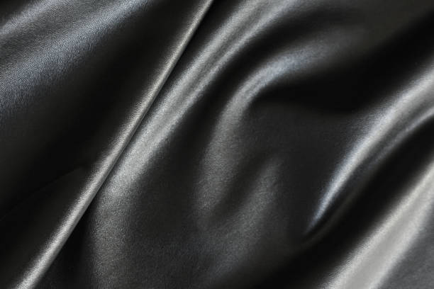 Shiny, silky and smooth surface of black fabric background background fake leather stock pictures, royalty-free photos & images