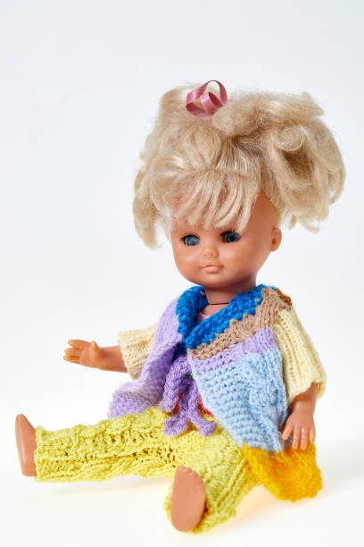 istock Vintage puppet,  blond curly hair, on white background 1142002571