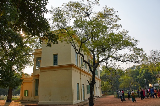 Shantiniketan (means abode of peace), a small town near Bolpur, at Birbum district of West Bengal. Famous for Visva-Bharati University, which was founded by Nobel laureate Rabindranath Tagore. Rabindranath Tagore’s vision of setting up a school along the lines of the previously existing system of gurukul (a residential school where students lived with their teacher/guru, a tradition present in India from Vedic period) – was the foundation stone of Visva-Bharati.\nToday it has become one of India's most renowned places of higher learning.\nPhoto taken inside Visva-Bharati University campus, on 12/17/2016.