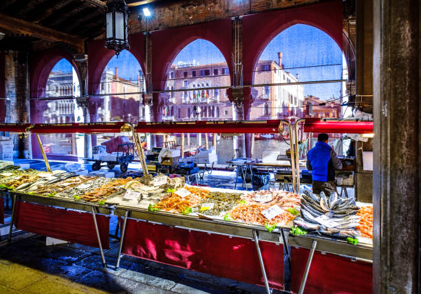 Venice, Italy - March 12: famous Mercato di Rialto - fish- and farmers-market near the rialto bride in venice on March 12, 2019