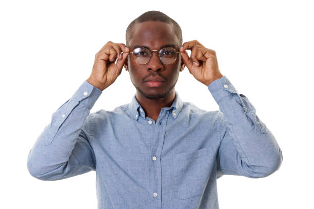 istock handsome young african american man with glasses by white background 1142003959