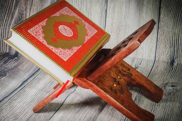 istock Islamic concept: Quran (Koran, al-Quran) against wooden background 1142007348