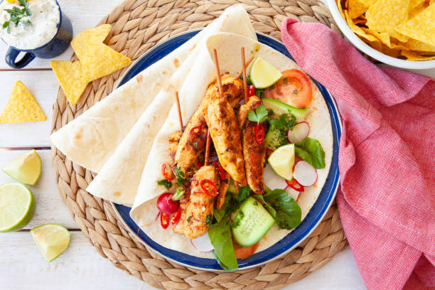 istock Grilled chicken skewers with fresh salad 1142008825