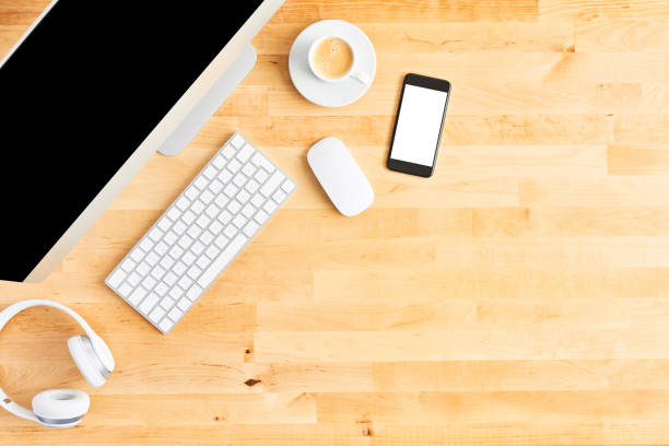 istock Modern workspace with large desktop computer and smartphone on wooden office desk 1142010676