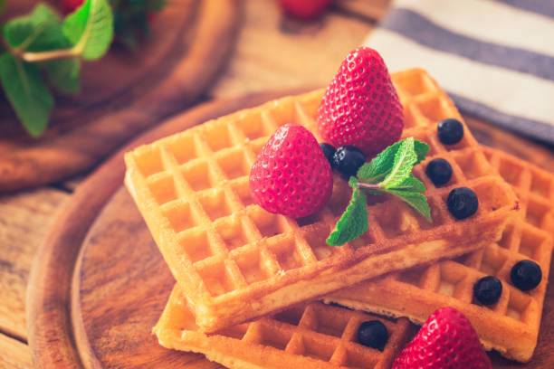 istock Waffles with strawberries and aronia at plate 1142011200