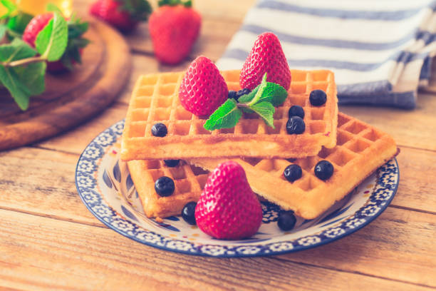 istock Waffles with strawberries and aronia at plate 1142011323
