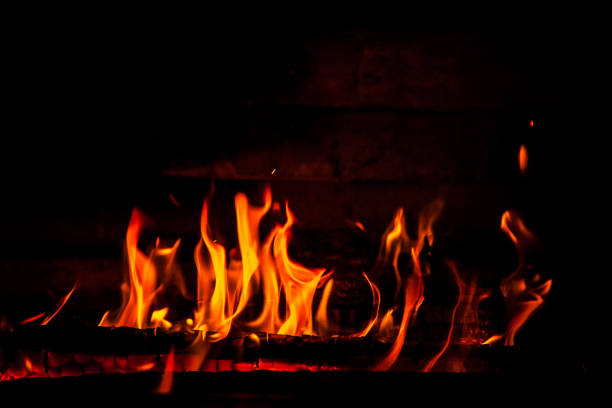 istock firewood burning red fire on a black background 1142012530