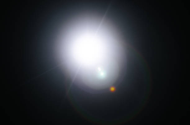 istock Abstract Natural Sun flare or Far star on the black background 1142014488