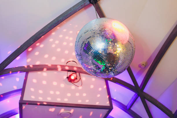 istock Disco ball with fireworks, night party background photo. 1142016592