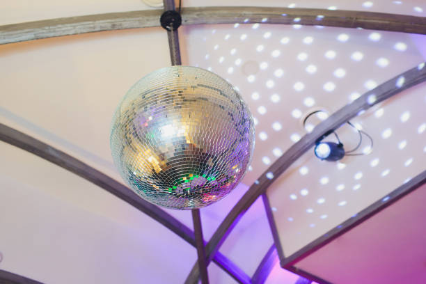 istock Disco ball with fireworks, night party background photo. 1142016601