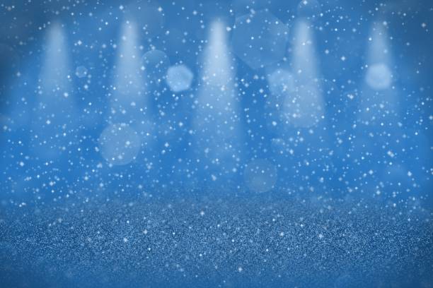 istock blue wonderful sparkling glitter lights defocused stage spotlights bokeh abstract background with sparks fly, festive mockup texture with blank space for your content 1142018930