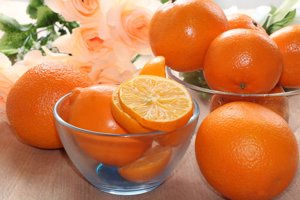 Cozy Holiday Decor with Oranges and Candles in a Festively Lit Room.
