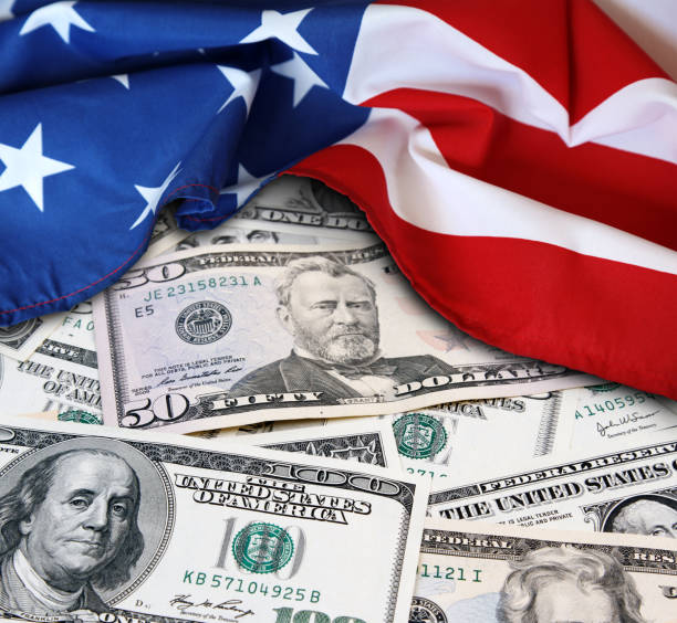 istock USA flag and cash 1142031111