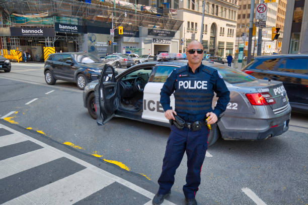 Toronto Police Force safeguarding protests in Toronto downtown and Nathan Phillips square Toronto, Canada-April 10, 2019: Toronto Police Force safeguarding protests in Toronto downtown and Nathan Phillips square tear gas photos stock pictures, royalty-free photos & images