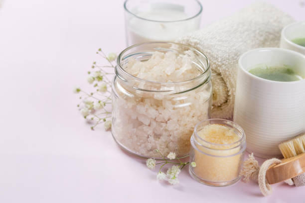 istock SPA concept - towel, salt, candle on pink background 1142032794