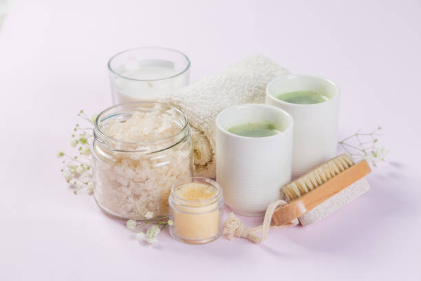 istock SPA concept - towel, salt, candle on pink background 1142032830