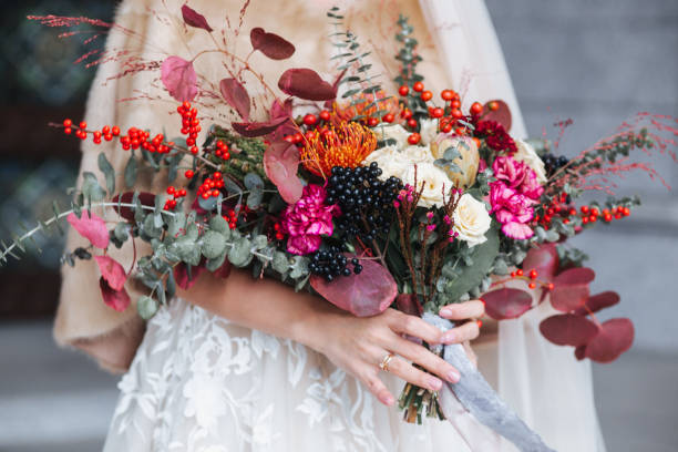 istock Beautiful wedding bouquet in the bride's hands 1142039582