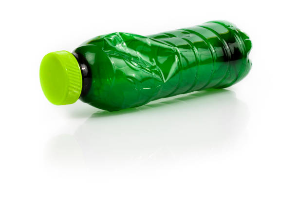 Environmental conservation and recycling concepts: Crushed bluish plastic bottle isolated on white background. Useful copy space available for text and/or logo. Predominant colors are blue and white. High key DSRL studio photo taken with Canon EOS 5D Mk II and Canon EF 70-200mm f/2.8L IS II USM Telephoto Zoom Lens