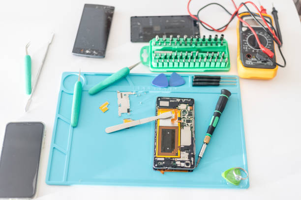 istock mobile phone parts and repairing tools, technician workspace. 1142050555