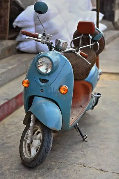 Photo of Blue motor scooter parked in the Sunday market. Hotan City-Xinjiang-China-0095