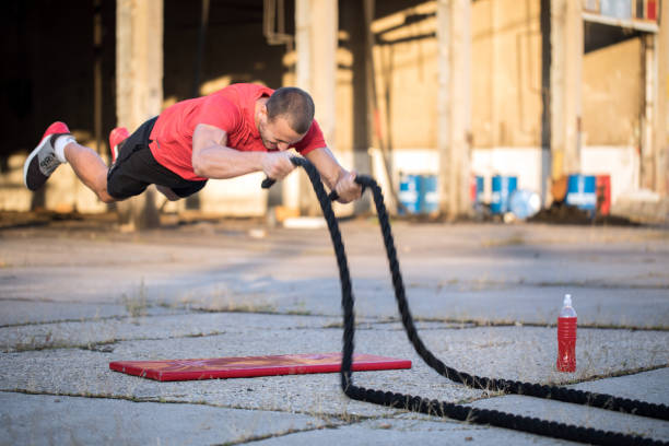 istock Male athlete flying with ropes 1142051357